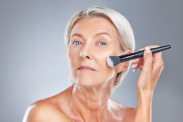 Image showing Makeup, cosmetic brush and woman face of a model with healthy skin, wellness and skincare. Beauty, cosmetics and dermatology treatment of an serious old person from Germany start getting ready