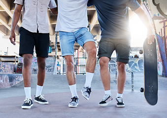 Image showing Fitness, skateboard and legs of friends at a skatepark in a city for training, sports and summer fun. Shoes, men and skateboarder group walking before a workout, practice and skating together