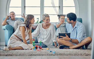 Image showing Family, love and digital tablet on floor with baby, parents and grandma bond, play and relax in living room together. Happy family, girl and generations enjoy quality time on carpet with online game