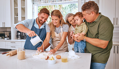 Image showing Grandparents, parents and child baking in kitchen together making sweet treats for family. Love, bonding and big family together teaching, learning and making food with young boy in family home