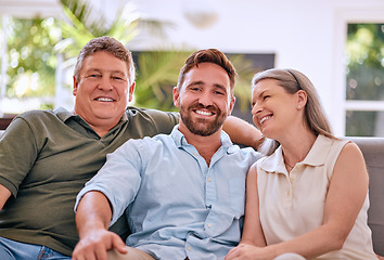 Image showing Happy family, portrait and adults relax on a sofa with senior couple, son and laughing in a living room, quality time and adults. Love, face and family on a couch, bonding and happy in their home