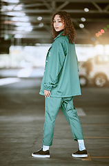 Image showing Fashion, style and woman in urban parking lot posing in stylish, trendy and designer clothing. Creative, fashionable and young black woman in city car park or garage with confidence in modern outfit