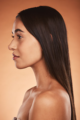 Image showing Skincare, hair and woman in studio for beauty, cleaning and grooming on orange background mockup. Skin, facial and wellness model relax, facial and pamper, hair care, hygiene, and space with mock up