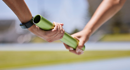 Image showing Sports, running and hands of runner with baton for exercise, fitness and speed at stadium. Sport, hand and team relay race challenge at running track by people marathon training, workout and energy