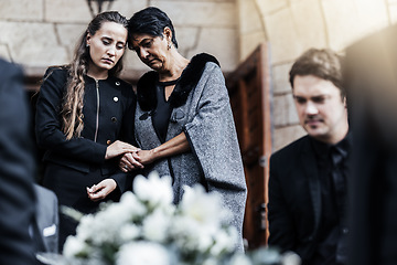 Image showing Funeral, senior mother and woman sad, crying and death in family, church and grief for loss of life. Young female comfort, care and support elderly mom after ceremony or service outdoor a chapel