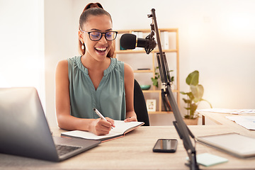 Image showing Podcast microphone, laptop and woman writing in notebook for ideas, research or information. Influencer, presenter or journalist planning blog for live streaming, radio talk show or online broadcast.