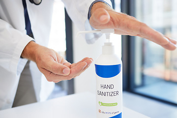 Image showing Doctor, hands and sanitizer for hygiene protection against virus, disease or bacteria at the workplace. Hand of healthcare professional using sanitary equipment for medical wellness and clean safety