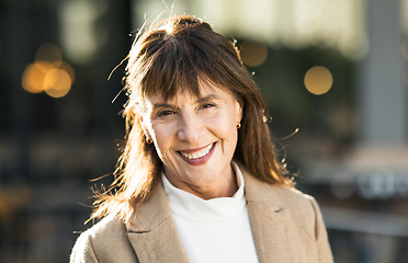 Image showing Portrait, mature woman and businesswoman in the city commuting to work or her office. Face, front and executive or leading traveling female in an urban town for travel to professional workplace