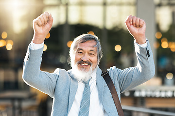 Image showing Asian man, winner and business, success with fist up outdoor for celebration after winning, achievement or opportunity in city. Portrait of china entrepreneur celebrate goals for motivation outdoor