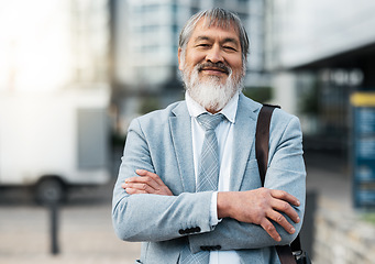 Image showing Mature Japanese businessman, arms crossed or city travel by office building street or public transport station. Portrait, smile or happy corporate manager, asian ceo or leadership with success goals