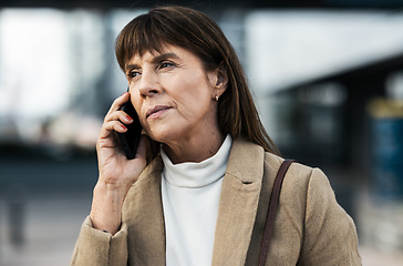 Image showing Phone call, city and serious senior woman in professional communication with legal client on mobile. Lawyer, thinking and listening to 5g smartphone conversation on urban town commute.