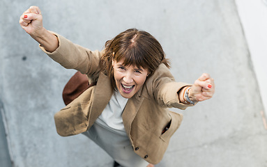 Image showing Business woman, winner and celebration for promotion, opportunity or city achievement for career goals and success. Happy entrepreneur excited and happy for motivation to celebrate bonus and target