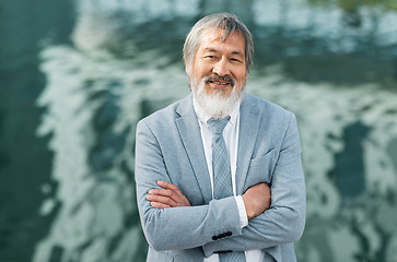 Image showing Happy, corporate and businessman in the city with arms crossed for management, ceo and manager in Colombia. Success, trust and portrait of a mature worker and boss with pride and smile in a suit