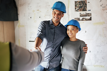 Image showing Handshake, construction and couple consulting, planning and doing inspection of home renovation with a contractor. Meeting, thank you and man and woman shaking hands with an architect in their house