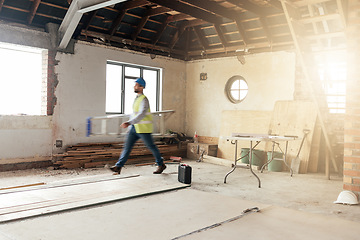 Image showing Construction, house and contractor walking in a building with maintenance, renovation and work with sunshine. Architecture, home renovation and fast construction worker on a site working as a builder