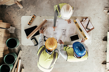 Image showing Top view, construction workers or blueprint planning in house, home or office building in real estate, property or architecture innovation. Men, engineering woman or construction site people or ideas