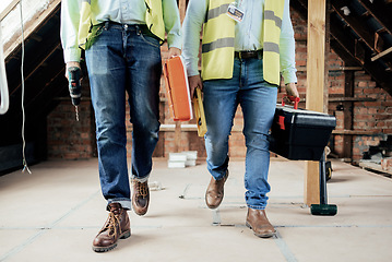 Image showing Construction, team and legs of engineers walking on the building site for home renovation project. People, construction worker teamwork and feet of men walking in industrial building for maintenance