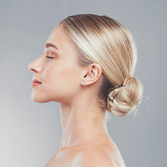 Image showing Face, beauty and skincare with the profile of a woman in studio on a gray background for wellness or treatment. Luxury, wellness and cosmetics with a model female posing to promote a natural product