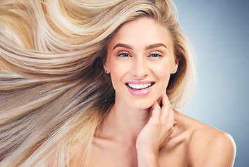 Image showing Salon, blowing blonde hair and portrait of woman with smile on face, beauty and wellness. Hair salon, hair care and female with fresh hairstyle pose for shampoo, conditioner and designer hair product