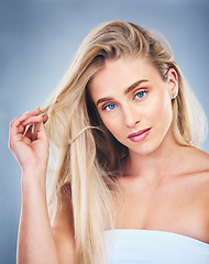 Image showing Salon, hair and woman on with care for hairstyle and strength on a grey studio background. Haircare, hair style and beauty woman with healthy blonde hair for glamour and cosmetic treatment