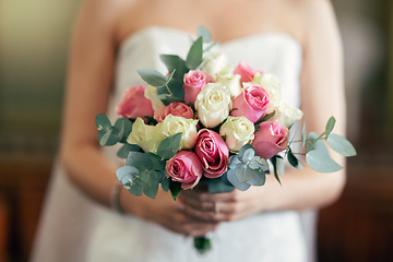 Image showing Bride, hand and rose bouquet, flowers and wedding decoration with plants on marriage ceremony day. Flower, hands and woman in dress holding plants for marriage event with scent, fragrance and beauty