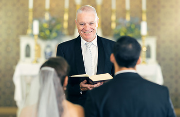 Image showing Wedding, priest and couple at the altar saying vows while getting married in a church for commitment, love and care. Birde and groom or man and woman with a pastor for marriage, support and religion