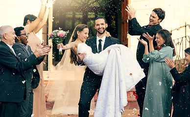 Image showing Wedding, love and man carrying woman outside church fo celebration of loving vows. Commitment and romance, romantic marriage, fun and man holding woman after love ceremony for bride and groom