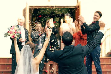 Image showing Wedding, applause and couple holding hands in celebration with support from clapping guests, friends and family. Back view, bride and groom celebrate trust, hope and success in love at a social event