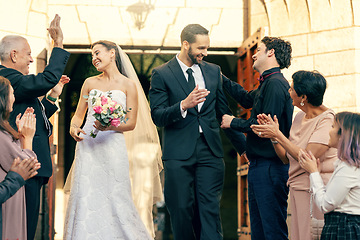 Image showing Wedding, celebration and love of family and friends while outdoor to support couple on their wedding, union and commitment at church. Happiness, love and crowd celebrate marriage of man and woman