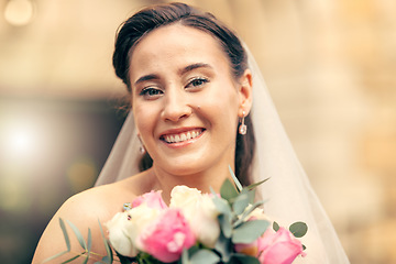 Image showing Beauty, bride and portrait of a woman holding a flower bouqet on her wedding day. Female, beautiful and cosmetics with face of lady holding a floral bunch on her marriage day at commitment ceremony