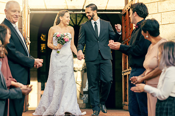 Image showing Wedding, man and woman celebrating their love by church after a commitment ceremony with guests. Marriage, married and loving couple in romantic celebration with husband and wife for romance