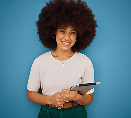 Image showing Happy black woman afro, tablet and smile for education, learning and technology against a blue studio background. Portrait of a African American female smiling for touchscreen communication on mockup