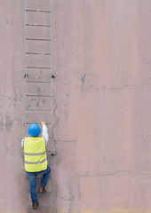 Image showing Engineer, building and man climbing ladder to get to roof or construction site. Engineering, safety and male maintenance, repair or installation contractor or worker going up steps on wall mock up.