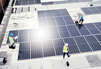 Image showing Solar energy, construction and employees building solar panels in collaboration for sustainability, maintenance and engineering. Teamwork, manufacturing and roof construction working on clean energy