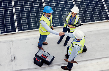 Image showing Handshake, engineering and team working on solar panels for inspection, maintenance or installation. Eco, solar energy and industrial workers shaking hands for a industry deal, agreement or teamwork.