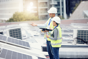 Image showing Engineering, solar panels and team planning a maintenance project outdoor in the city on a rooftop. Solar energy, eco friendly and industrial workers in collaboration working on photovoltaic cells.