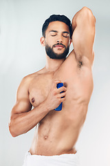 Image showing Beauty, deodorant and man spray for body hygiene, perfume and clean armpit product marketing. Cosmetic, grooming and healthy model smelling fresh scent for advertising with gray studio mockup.