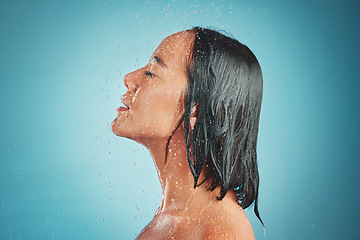 Image showing Woman, hygiene and wet shower for relax, beauty or fresh clean with water drops against a blue studio background. Relaxed female enjoying a hygienic wash and liquid sensation in cleanliness on mockup