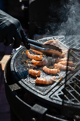 Image showing A professional cook prepares shrimps