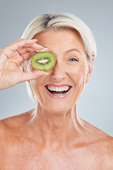 Image showing Kiwi, fruit and wellness of a senior woman with beauty skincare, health and a smile. Portrait of an happy elderly model holding food feeling happiness from healthy lifestyle, nutrition and wellbeing