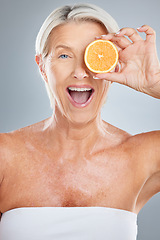 Image showing Beauty, senior and woman fruit portrait for natural anti aging, skincare and vitamin c product. Health, wellness and mature skin detox model with excited face for advertising in gray studio.