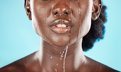 Image showing Water, mouth and face of a black woman with drops on her lips for hygiene, grooming and cleansing. Beauty, skincare and hydrating facial for an african american female with oral cleaning treatment