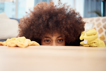 Image showing House cleaning, living room table and black woman by a sofa with gloves spring clean home. Cleaner, maid and person check for dust with a polish and sanitizer product for a wood wash with focus