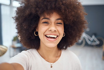 Image showing Portrait selfie, black woman and video call in home for social media, online network or influencer vlog. Happy, smile or laughing young african girl with afro, curly hair and happiness relax in house