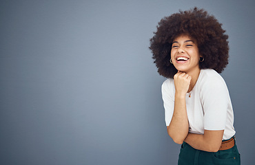 Image showing Relax, happy and black woman with natural hair in studio laughing at a funny joke with mockup space. Smile, happiness and young goofy African girl with an afro enjoying comedy, comic and freedom