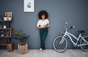 Image showing Tablet, bicycle and portrait of black woman in home web or internet browsing. Smile, relax and happy female from South Africa on digital touchscreen tech, mobile app or networking on social media.