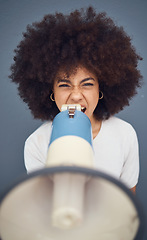 Image showing Woman, megaphone and shout for protest, opinion and voice for social justice against a studio background. Speaker, latino woman and portrait girl speaking protest, strike and marketing a announcement