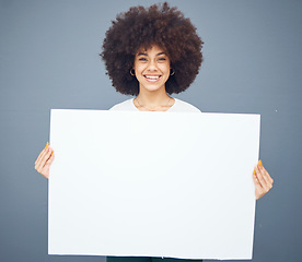 Image showing Woman, board and blank placard ready for marketing or advertising message on a grey studio background. Black female, poster and empty placard for advertisment, mockup or copyspcace sign