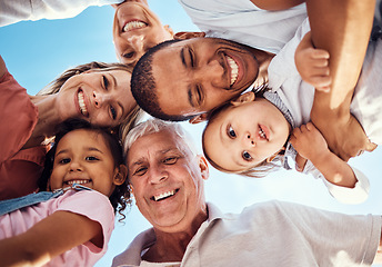 Image showing Diversity, huddle and family with smile, happy and bonding together for vacation, spend quality time and joyful. Interracial, grandparents or parents with kids being cheerful, happiness and low angle