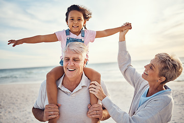 Image showing Beach, family and grandparents piggy back for holiday fun together with grandchild in Australia. Summer, ocean and vacation afternoon with happy senior grandma, grandfather and young kid.